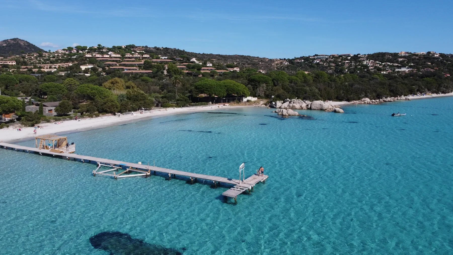 Turquoise water and a pale beach on the Corsican coast