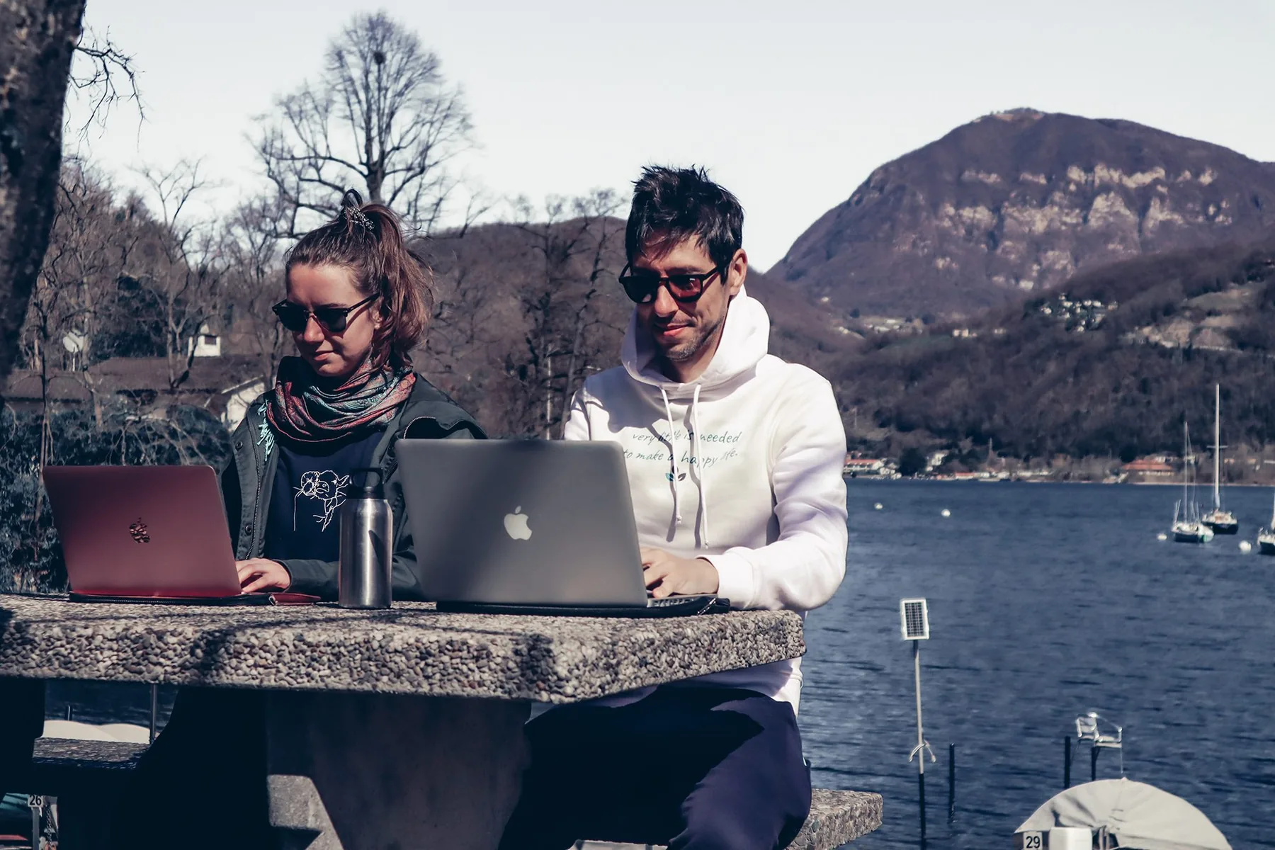 Working outdoors beside the van while travelling